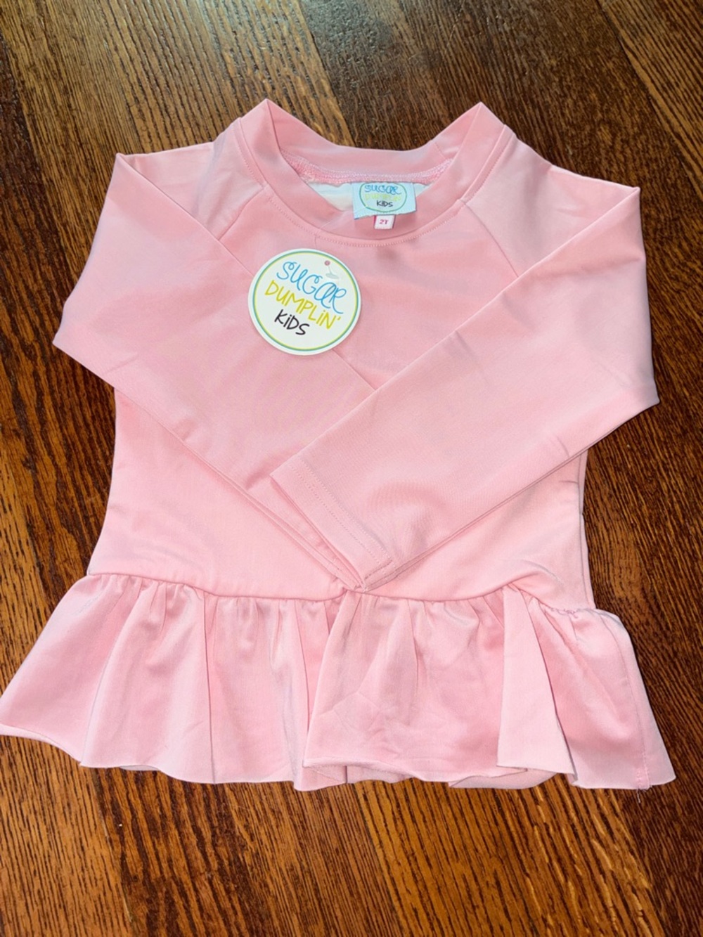 Sugar Dumpin’ Kids Pink Long-Sleeve Rashguard with Ruffle Hem